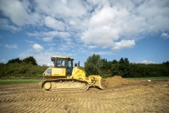 Golf course extension using inert soil